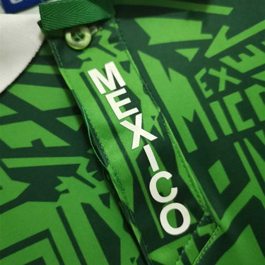 KODAA SPORT Mexico 1994 retro home football jersey with green geometric pattern and white 'MEXICO' text.