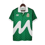 KODAA SPORT 1995 Mexico retro home football shirt with white collar and cuffs, featuring a repeating ABA SPORT logo pattern and a large white 'M' graphic.