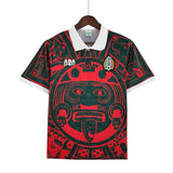 KODAA SPORT Mexico 1997 retro football jersey with Aztec sun design, red and green, white collar and cuffs.