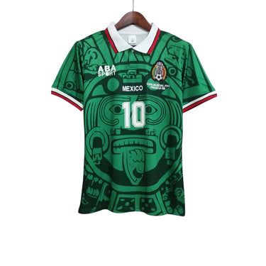 KODAA SPORT Mexico 1998 retro football jersey with green Aztec-inspired print and white collar.