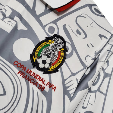 KODAA SPORT Mexico 1998 retro football jersey with white and grey abstract pattern, featuring the Mexico crest and 'COPA MUNDIAL FIFA FRANCIA 98' embroidery.