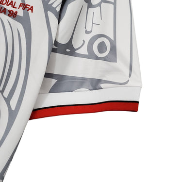 KODAA SPORT Mexico 1998 retro football jersey with white, grey, and red trim. Features iconic graphic print.