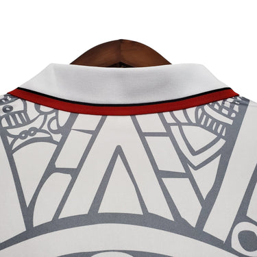 KODAA SPORT Mexico 1998 retro football jersey with white, grey, and red details. Features a classic collar and a unique graphic pattern.