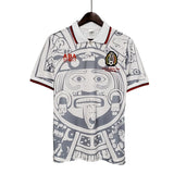 KODAA SPORT Mexico 1998 retro football jersey with Aztec sun stone graphic, white with grey and red accents.