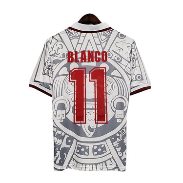 KODAA SPORT Mexico 1998 retro football jersey with Blanco 11 on the back, white with grey Aztec-inspired print and red trim.