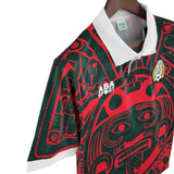 KODAA SPORT retro Mexico 1997 football jersey with a red and green Aztec-inspired pattern and white collar.