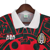 KODAA SPORT Mexico 1997 retro football shirt in red and green with white collar and repeating pattern.