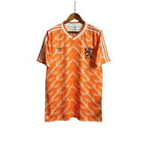 KODAA SPORTS Netherlands 1988 retro home football shirt. Orange with white Adidas stripes and geometric pattern. Features KNVB crest.