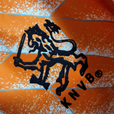 KODAA SPORTS Netherlands 1988 retro home football shirt with orange and white pattern and black lion crest.