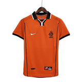 KODAA SPORTS Netherlands 1998 retro home football shirt. Orange short-sleeve jersey with black and white trim on collar and cuffs. Features Nike logo and KNVB crest.