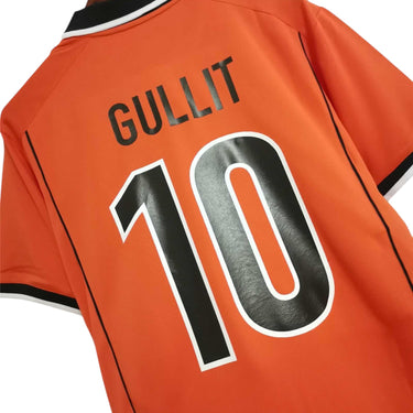 KODAA SPORTS Netherlands 1998 retro Gullit 10 football jersey. Orange short-sleeve shirt with black and white collar and trim.